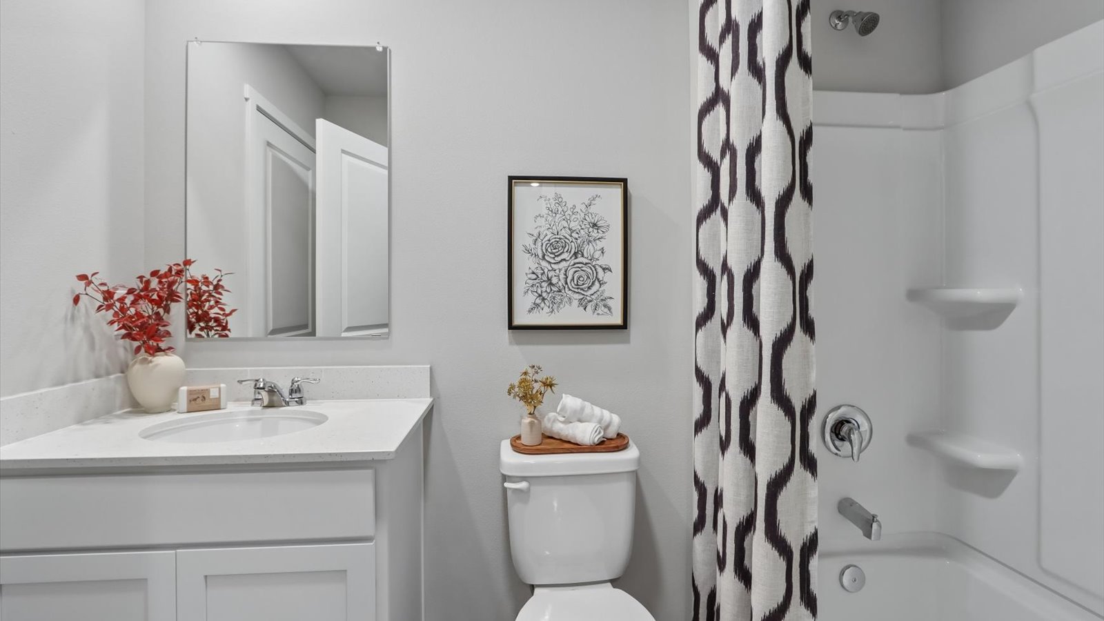 Stylish full bathroom with bright lighting and functional design.