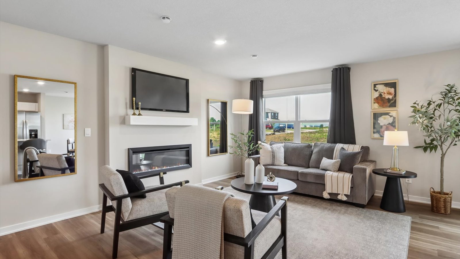 Open concept living room with electric fireplace