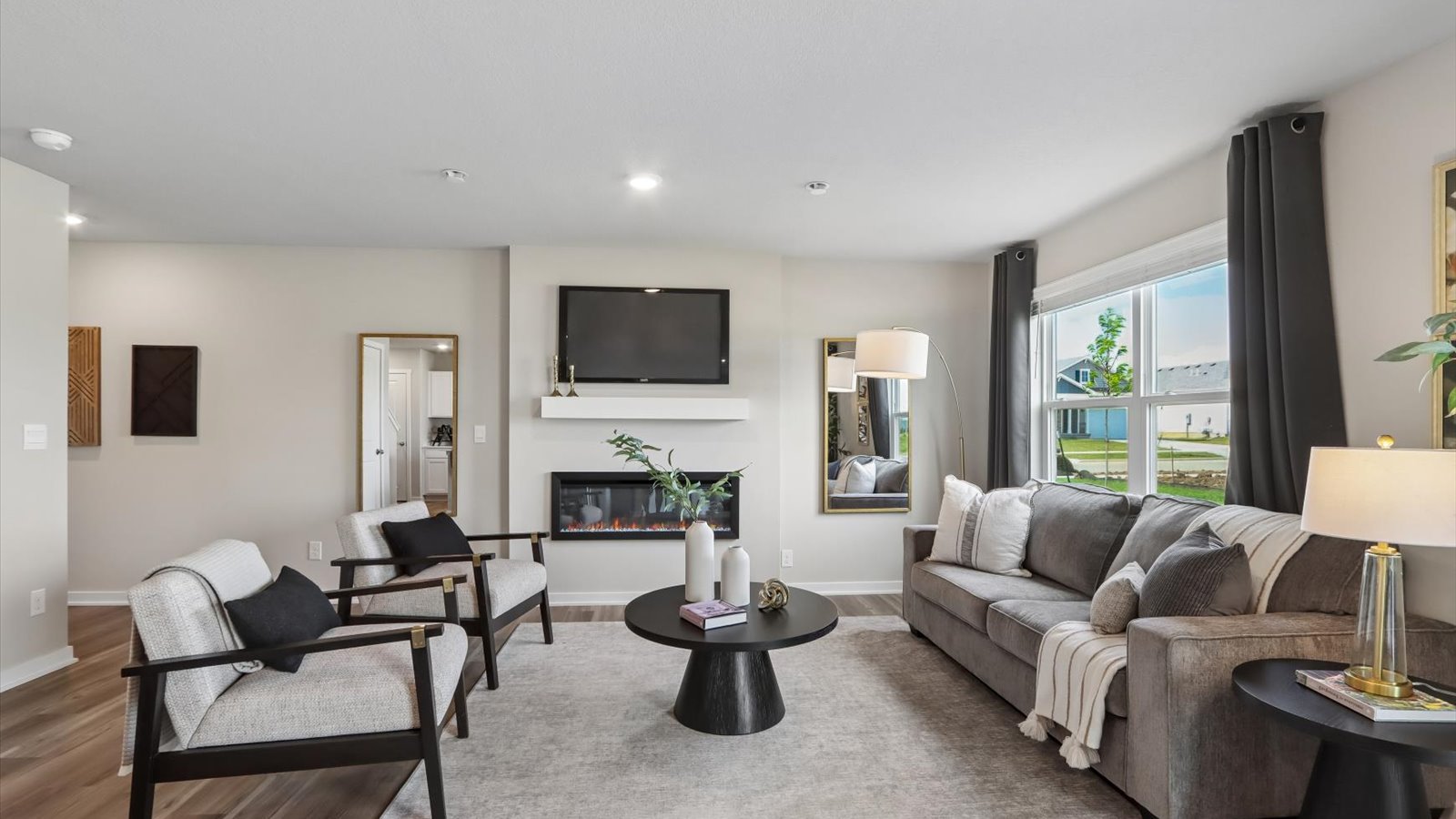 Open concept living room with electric fireplace