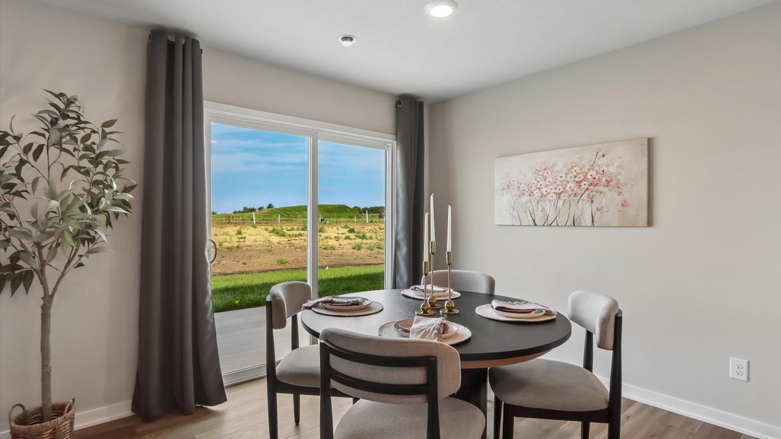Open concept dining space with access to backyard