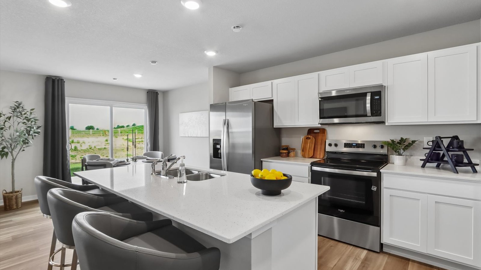 Kitchen with white cabinetry and quartz countertop