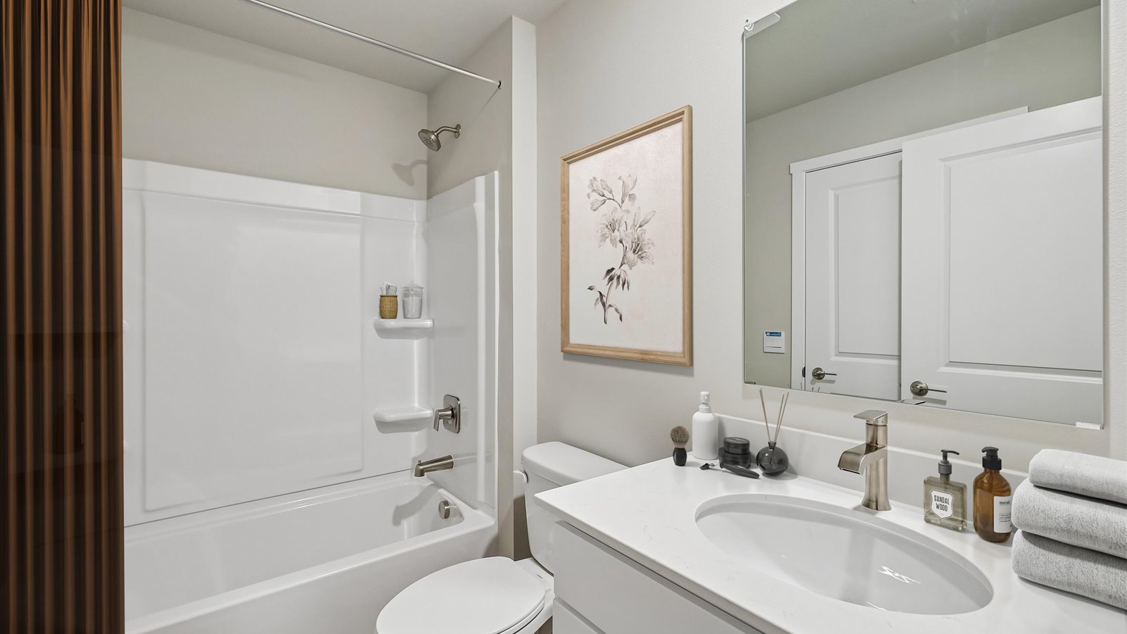 Stylish full bathroom with bright lighting and functional design.