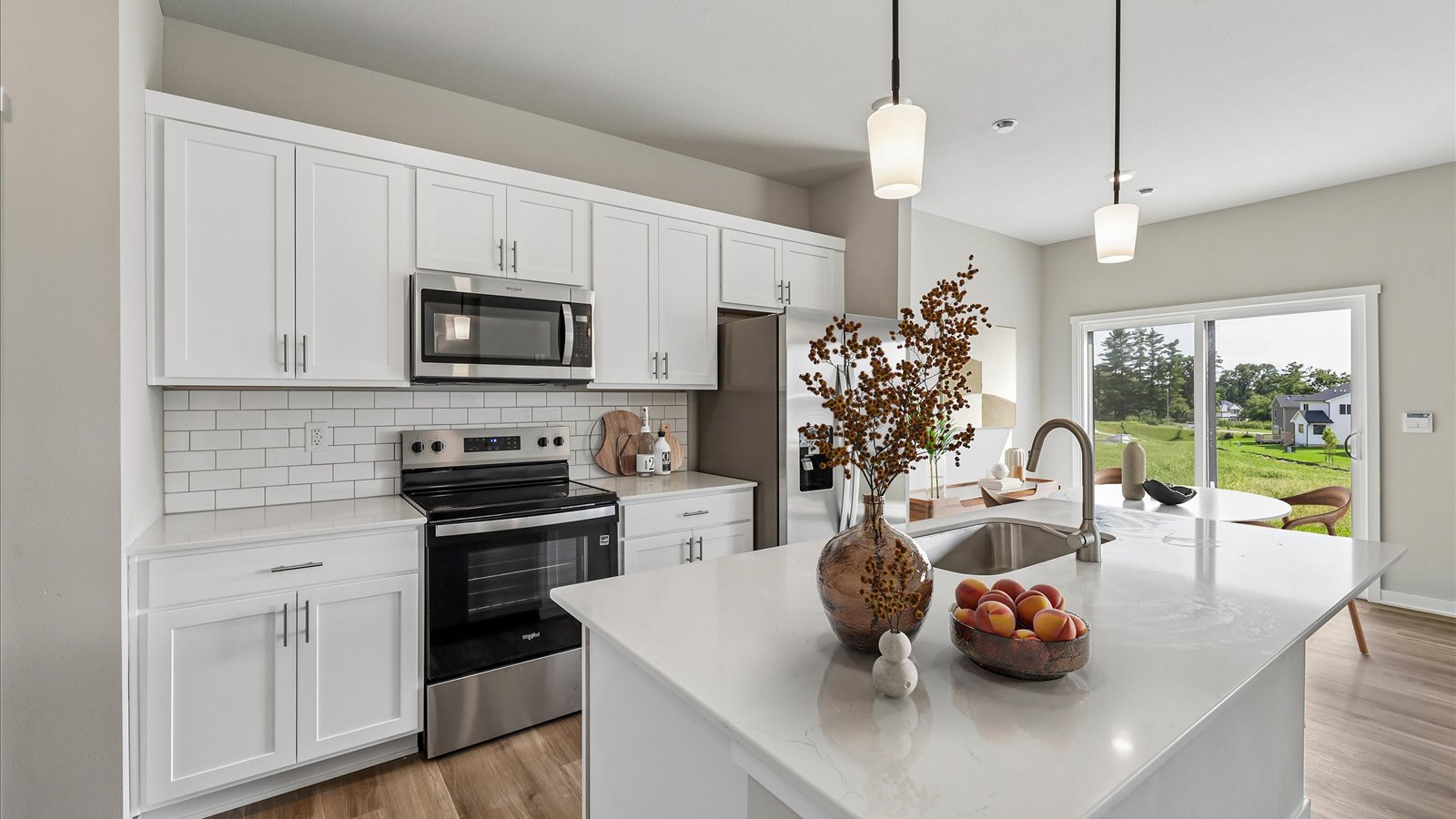 Kitchen with white cabinetry and quartz countertop