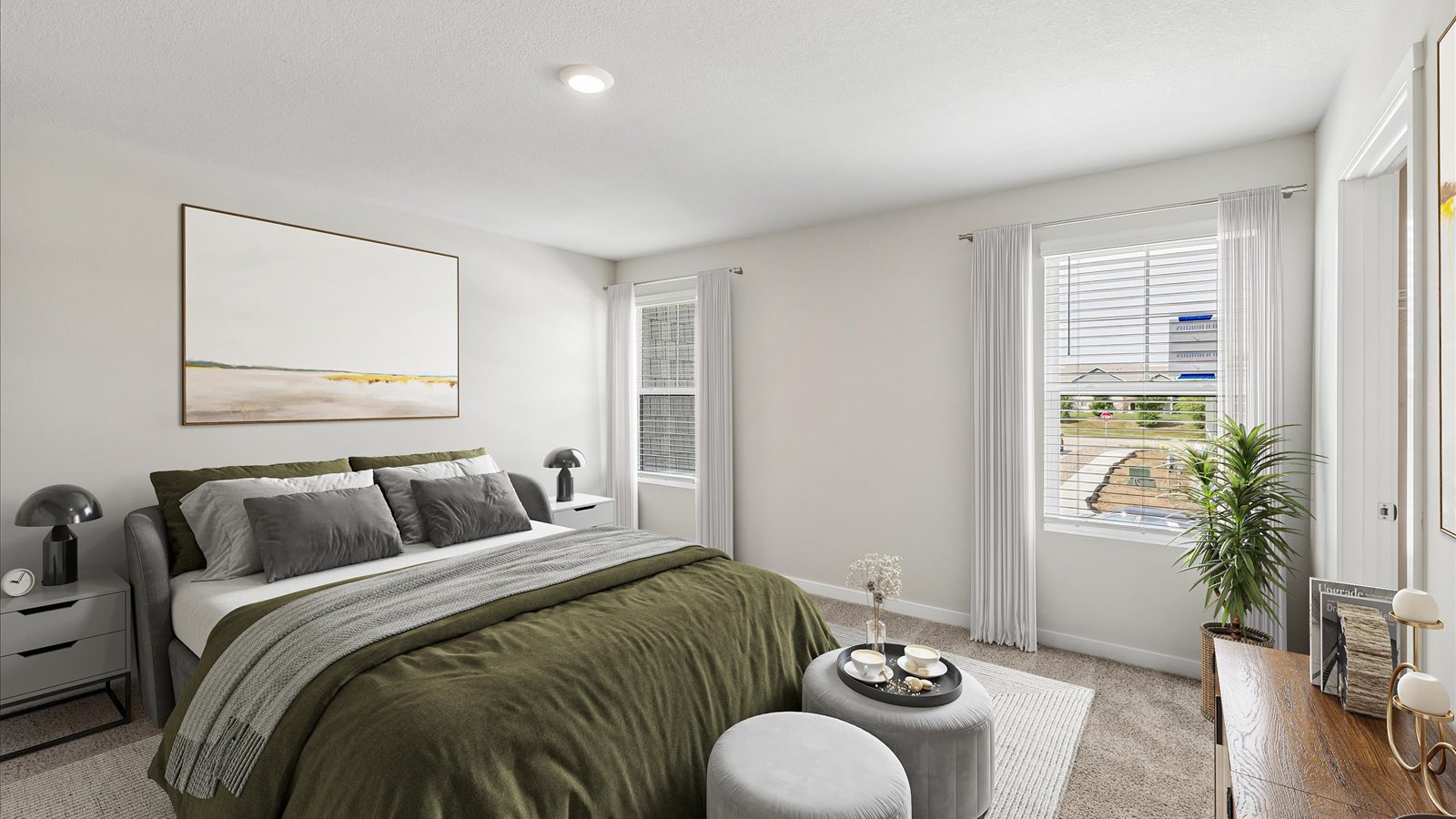 Primary bedroom with natural lighting and spacious layout
