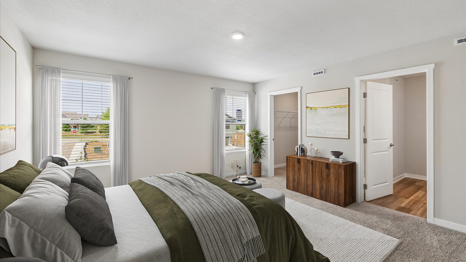 Primary bedroom with natural lighting and spacious layout