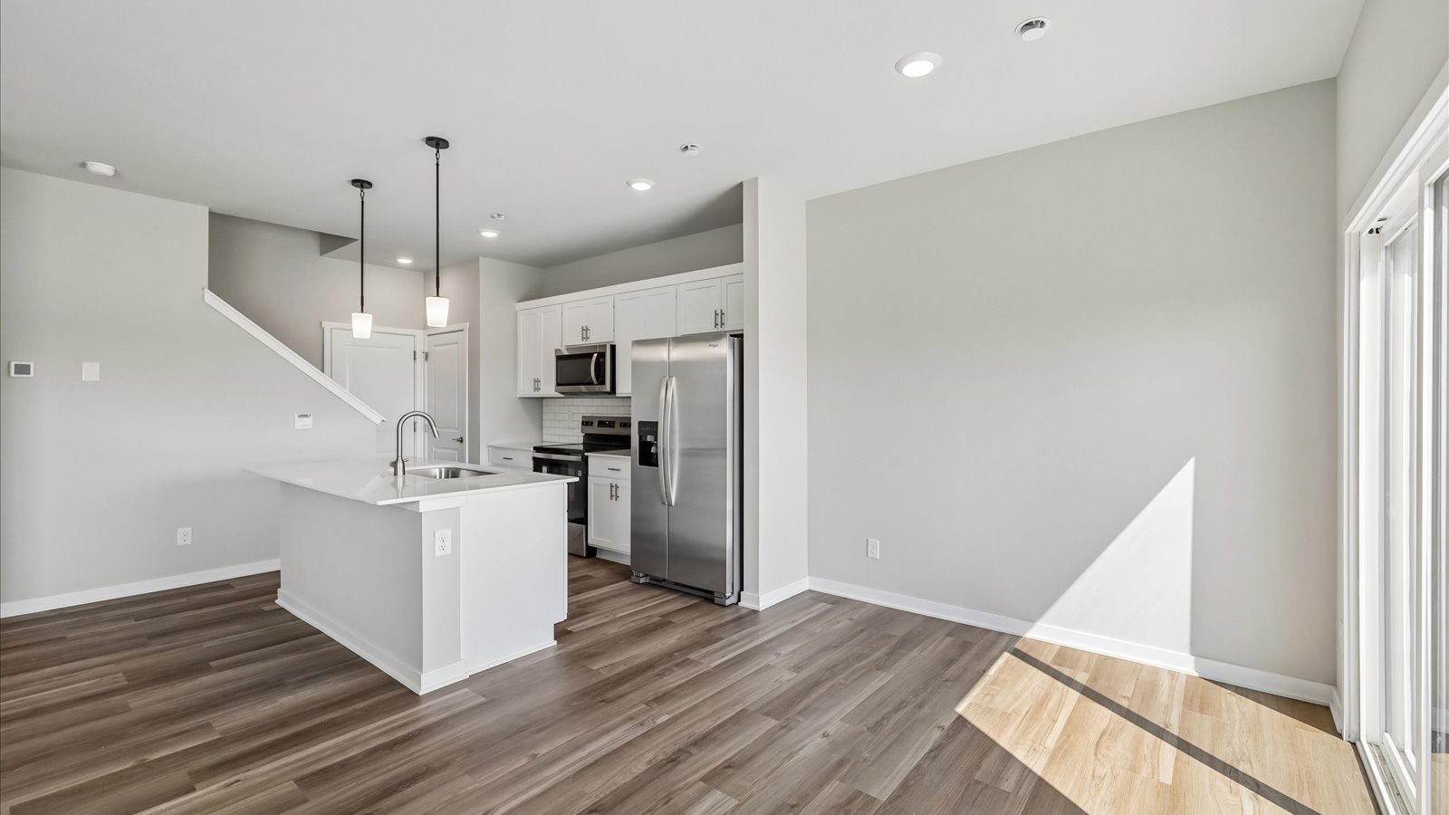 Kitchen with white cabinetry and quartz countertop