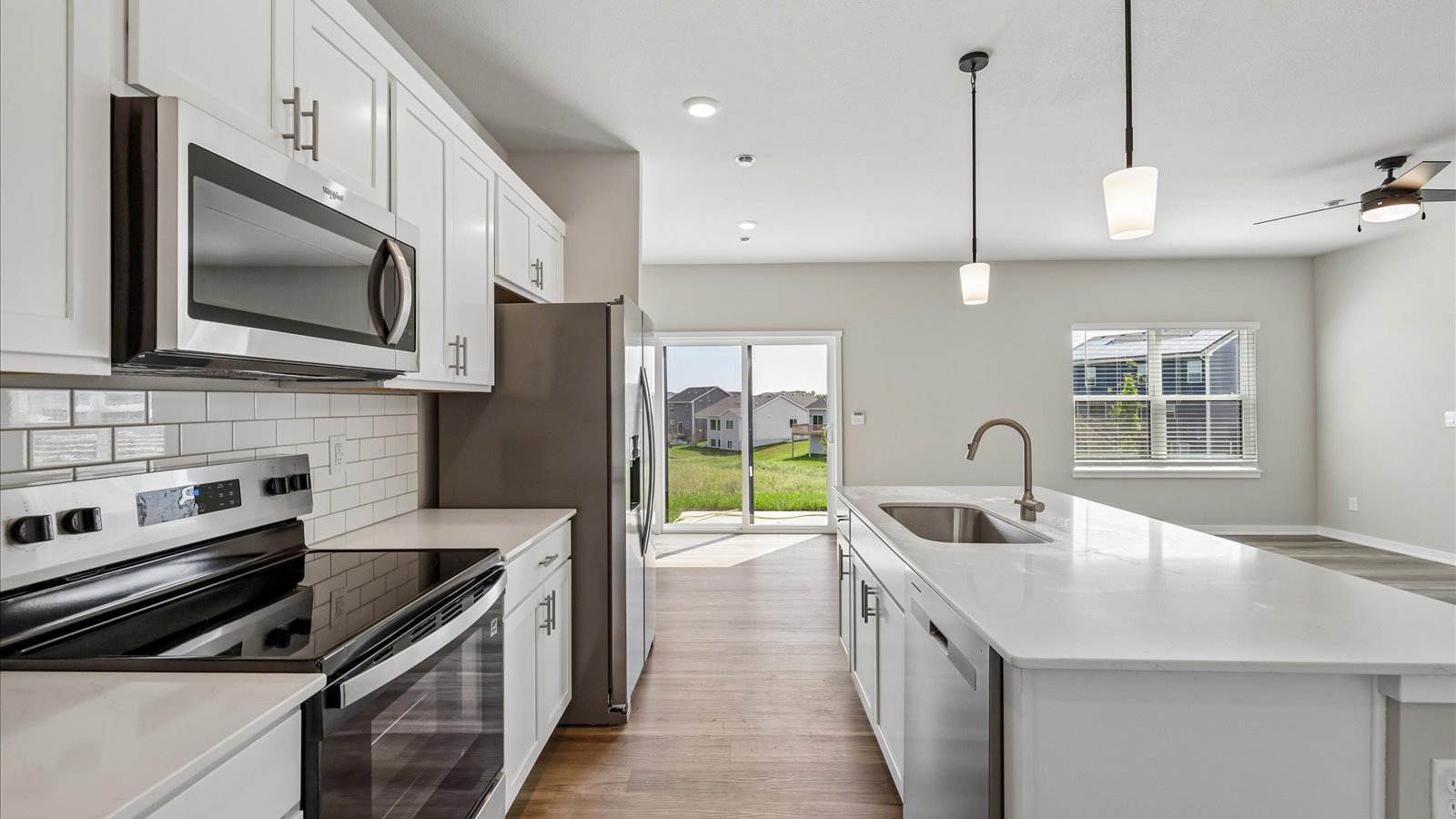 Kitchen with white cabinetry and quartz countertop