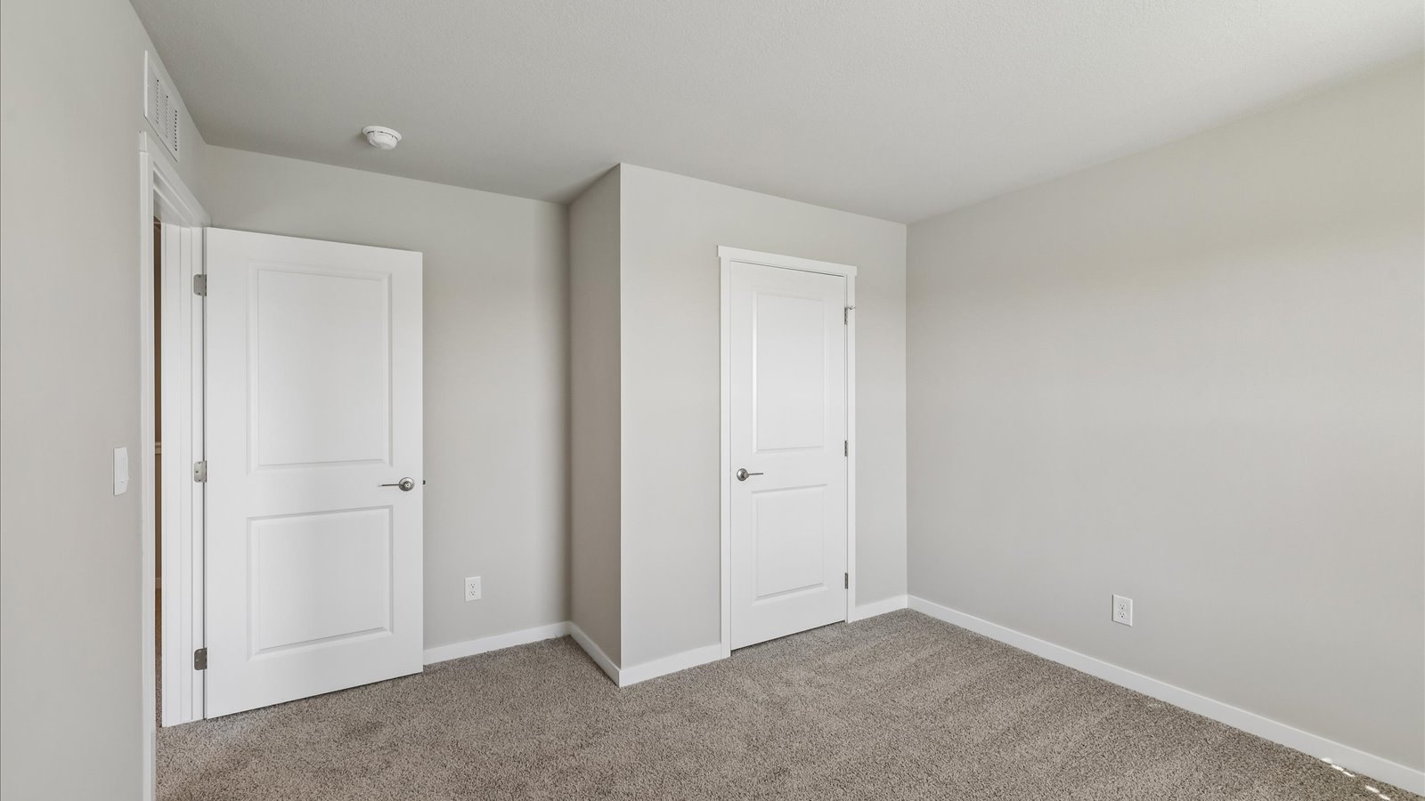 Comfortable secondary bedroom with natural light, modern finishes, and versatile living space.