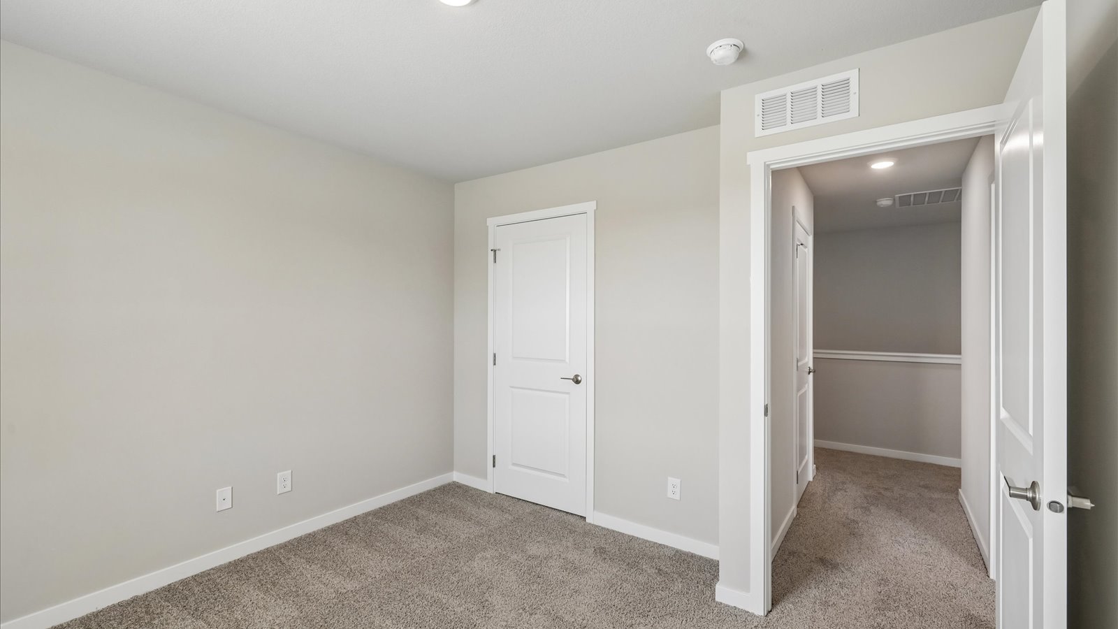 Comfortable secondary bedroom with natural light, modern finishes, and versatile living space.