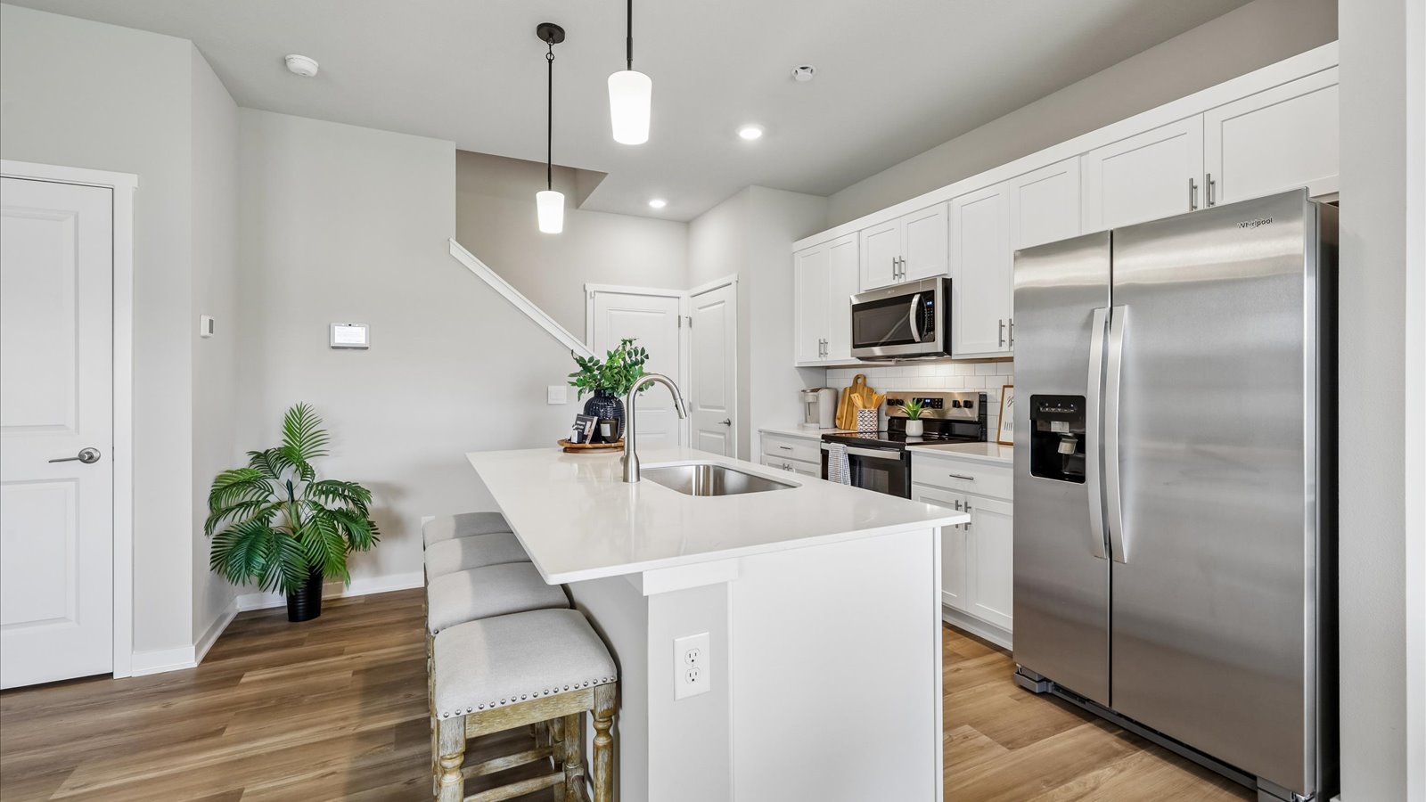 Kitchen with white cabinetry and quartz countertop