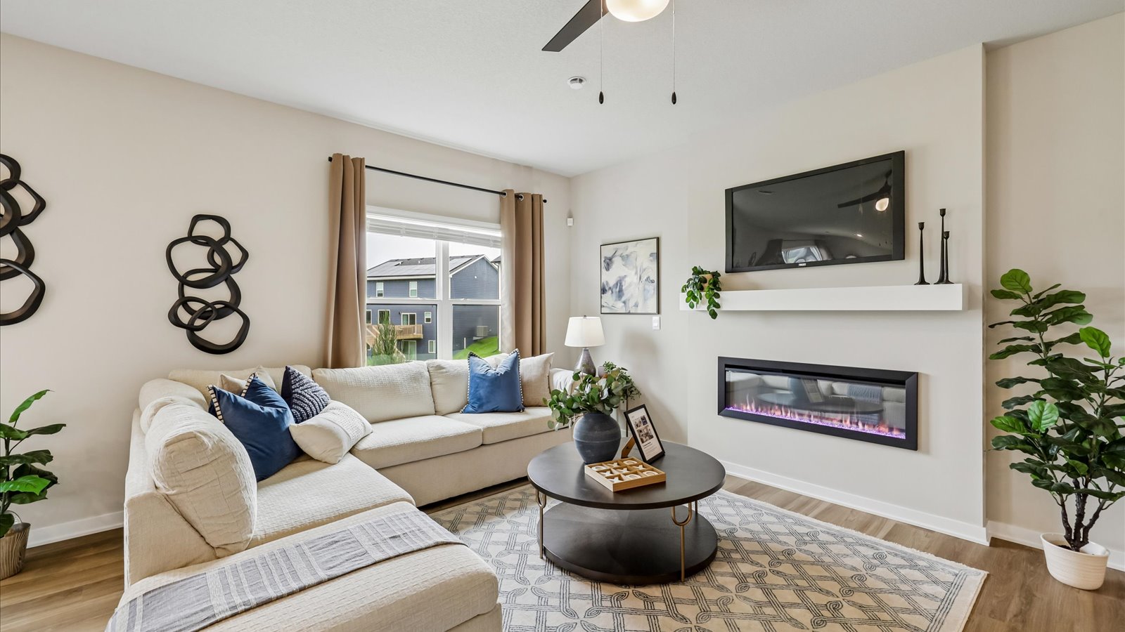 Open concept living room with electric fireplace