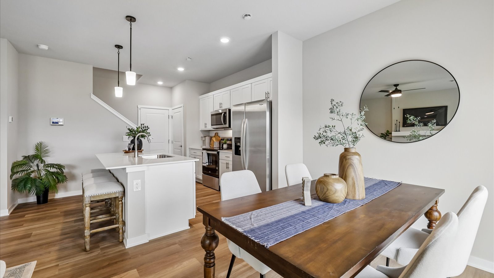 Open concept dining space with access to backyard