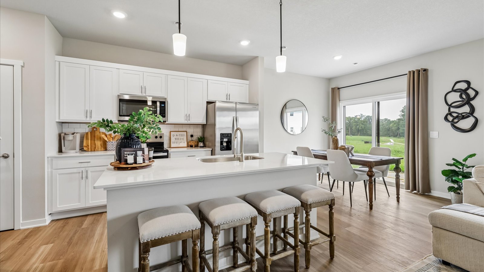 Kitchen with white cabinetry and quartz countertop