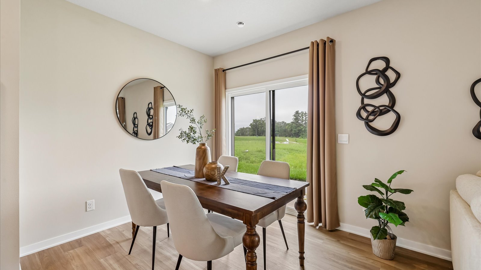 Open concept dining space with access to backyard