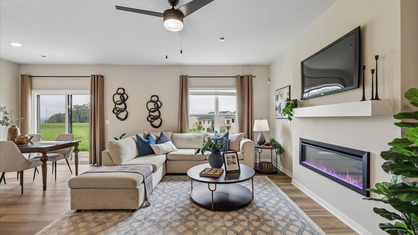 Open concept living room with electric fireplace