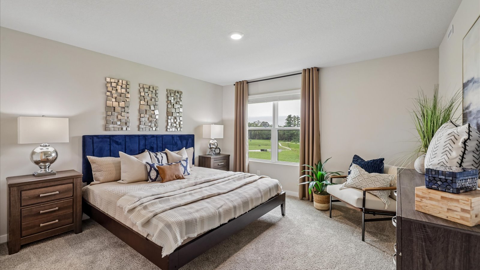 Primary bedroom with natural lighting and spacious layout