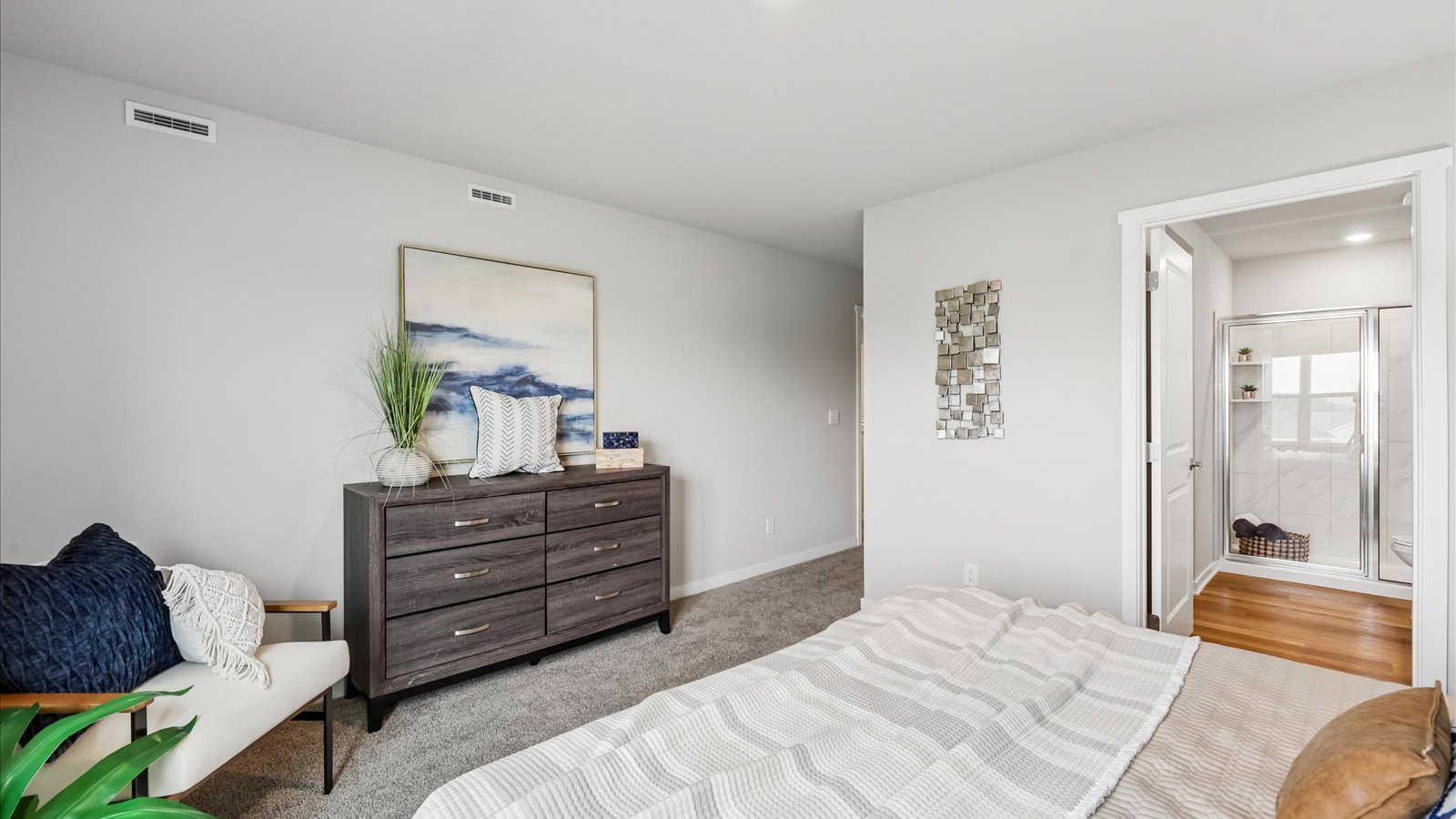 Primary bedroom with natural lighting and spacious layout
