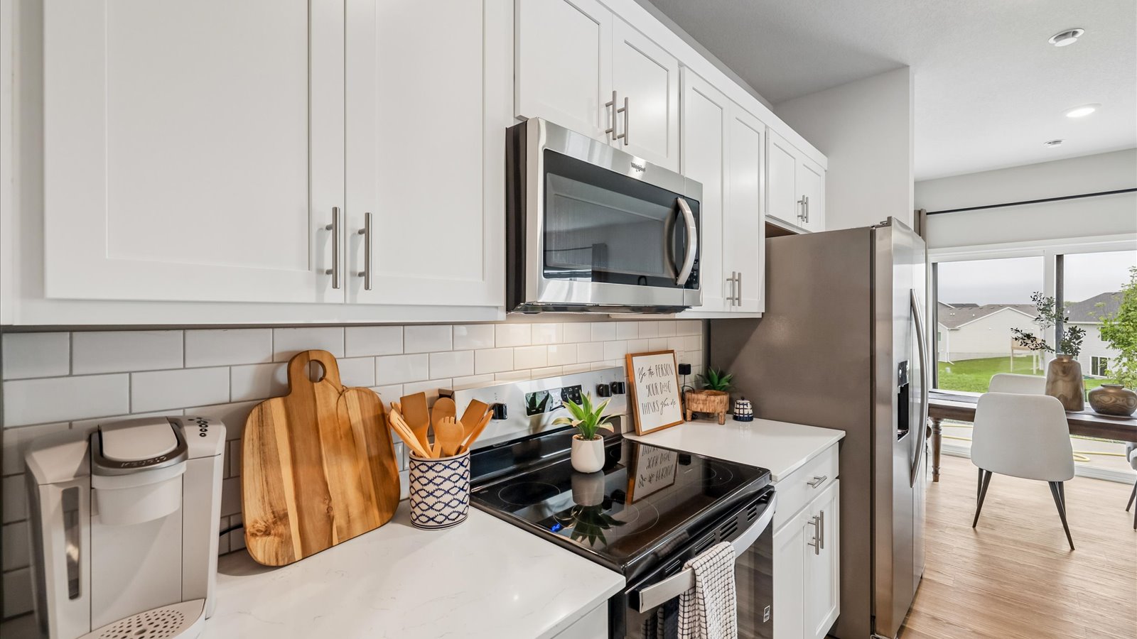 Kitchen with white cabinetry and quartz countertop