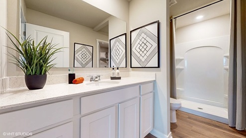 Primary bathroom with cabinets and shower