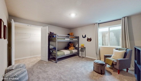 Finished basement with overhead lighting