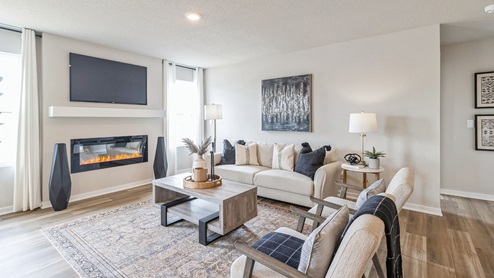 bright hamilton living room with white loveseat and two white chairs