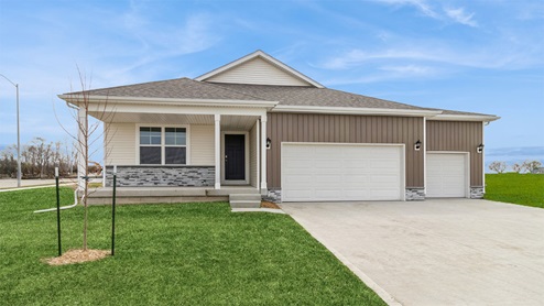 front exterior of hamilton ranch home with 3 car attached garage