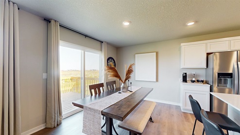 dining area with wood table next to sliding glass doors