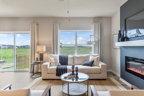 Living room with white couch and large window