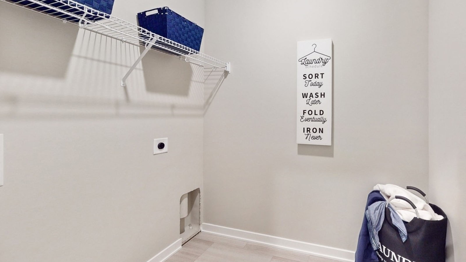 Laundry room with shelving