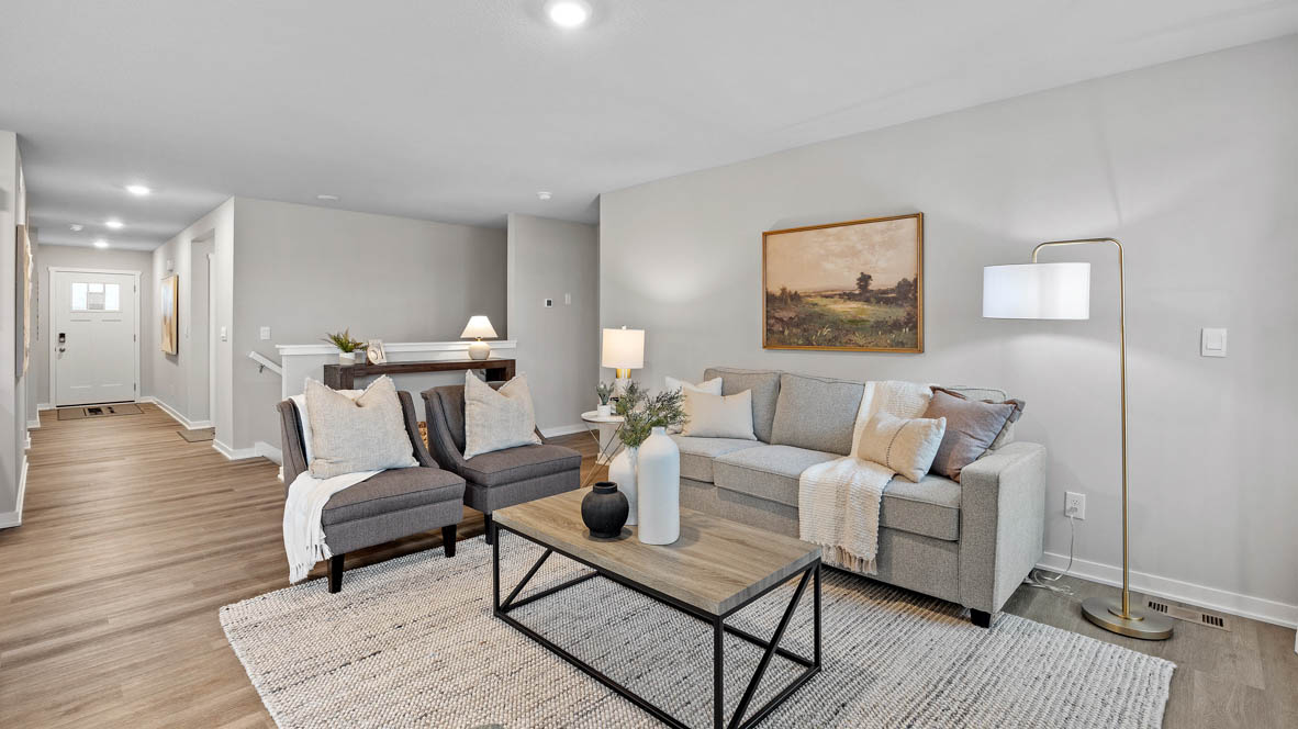 Living room with large area rug and coffee table