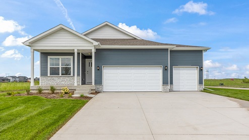 front exterior of roland home with 3 car attached garage