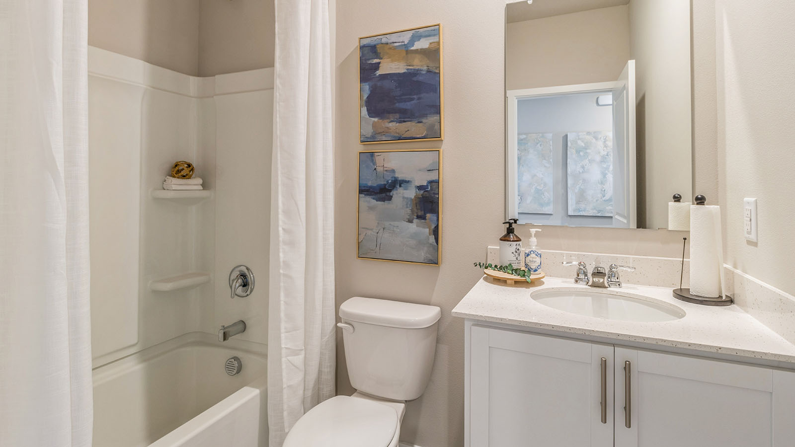 Second full bathroom with mirror and bathtub