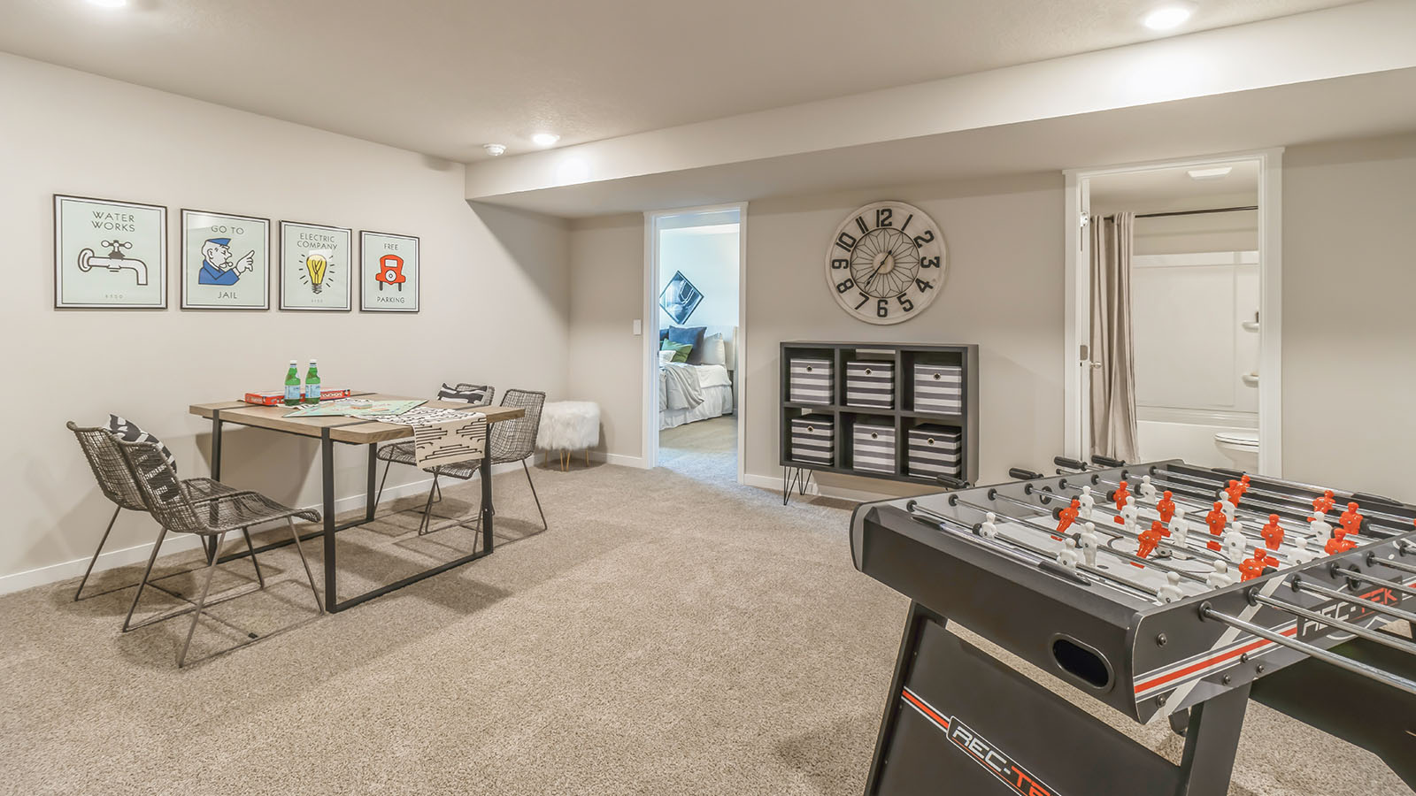 Family room in basement with foosball table and game table