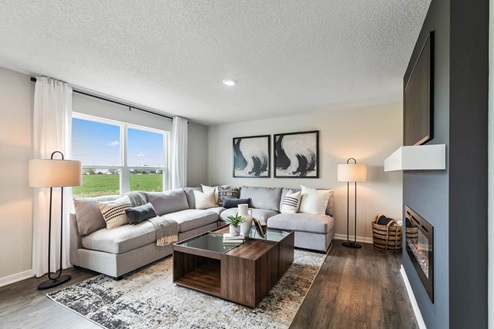 Well-lit living room with big window