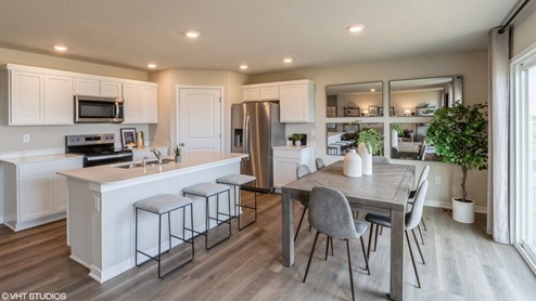 Dining table overlooking living room and kitchen