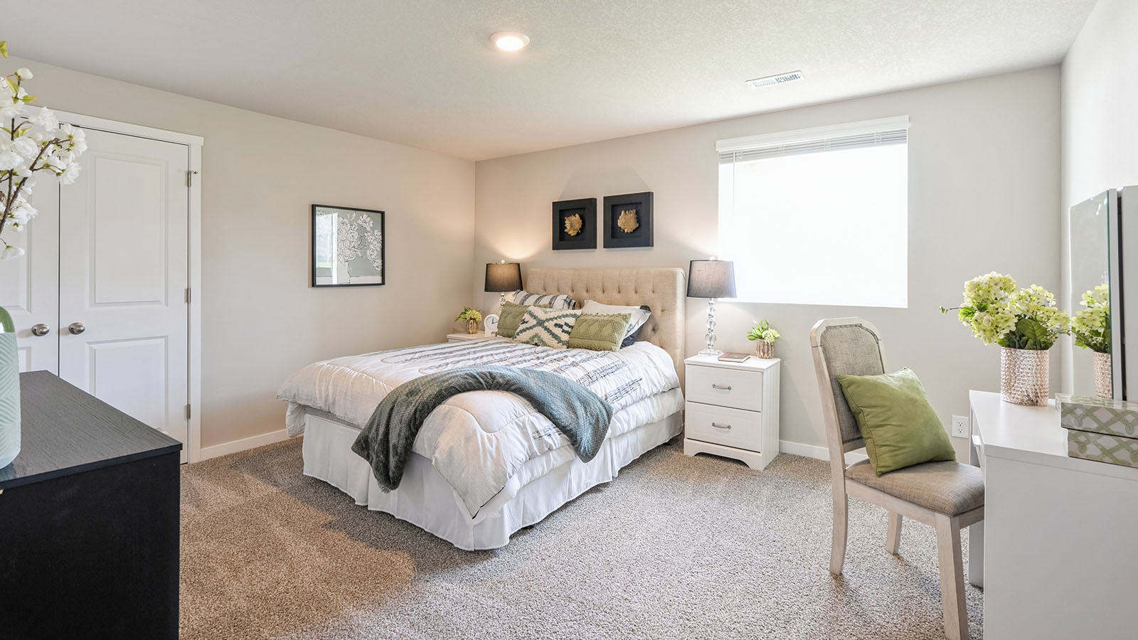 Third bedroom in basement with egress window and desk