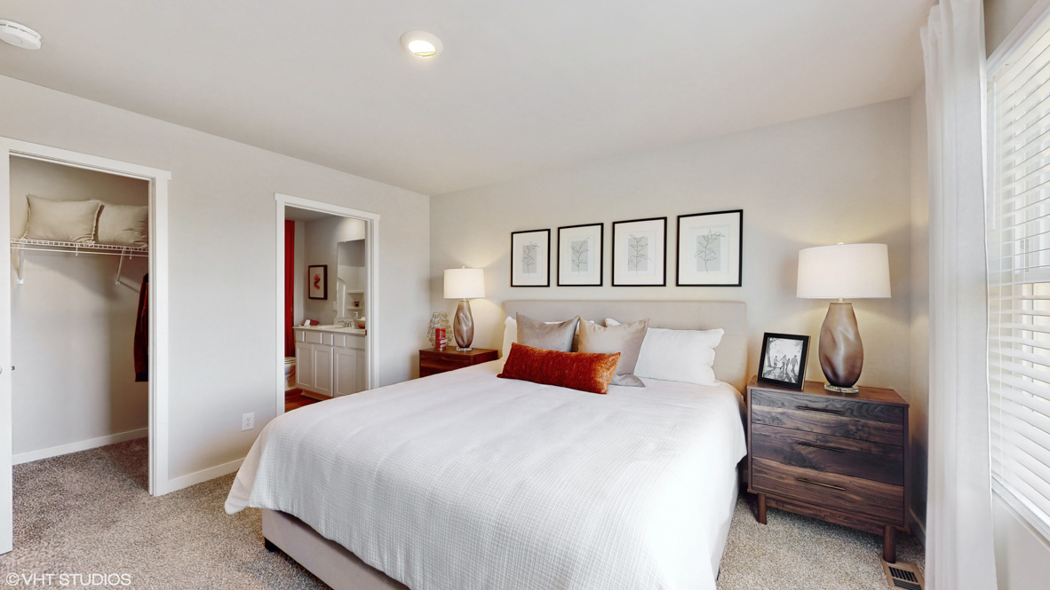 Primary bedroom with walk-in closet and bathroom