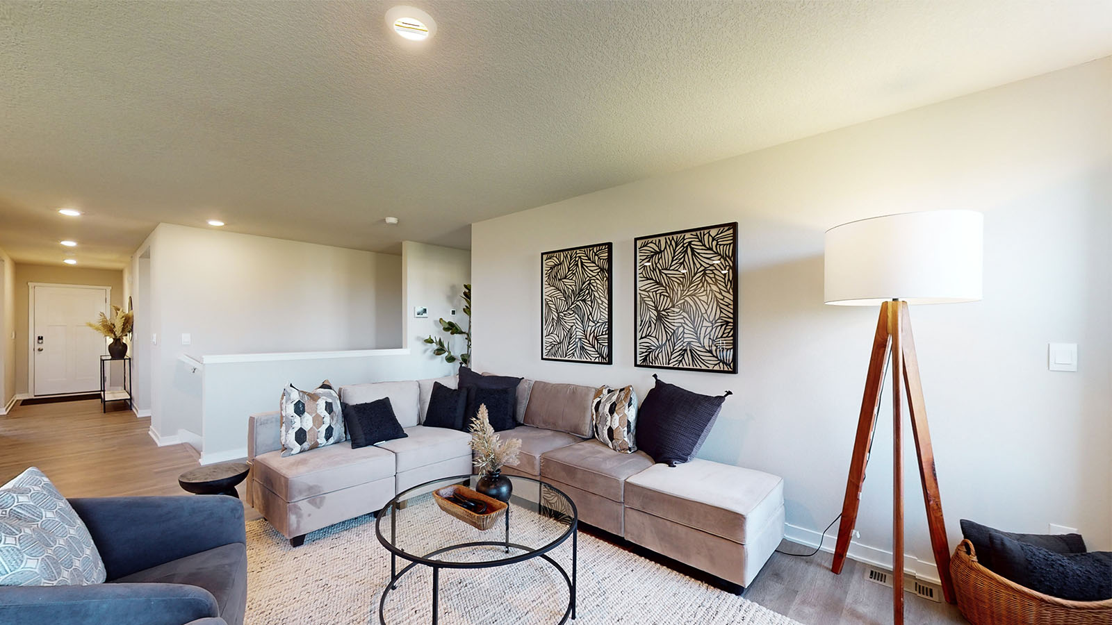 cozy living room with white couch and floor lamp