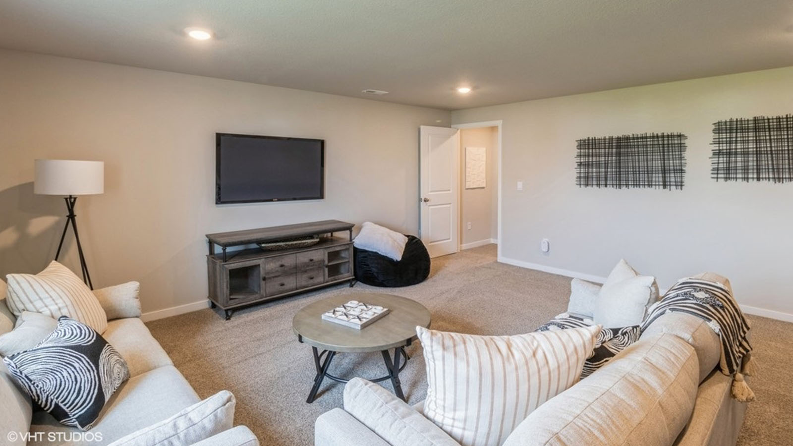 finished basement of the Hamilton with a large seating and entertainment area