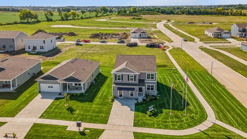 Aerial view of Bellhaven model with new construction homes in the background