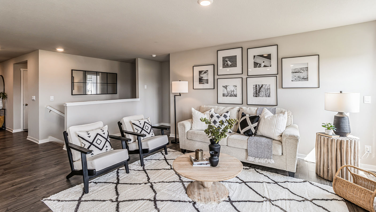 Living room with view of staircase and seating