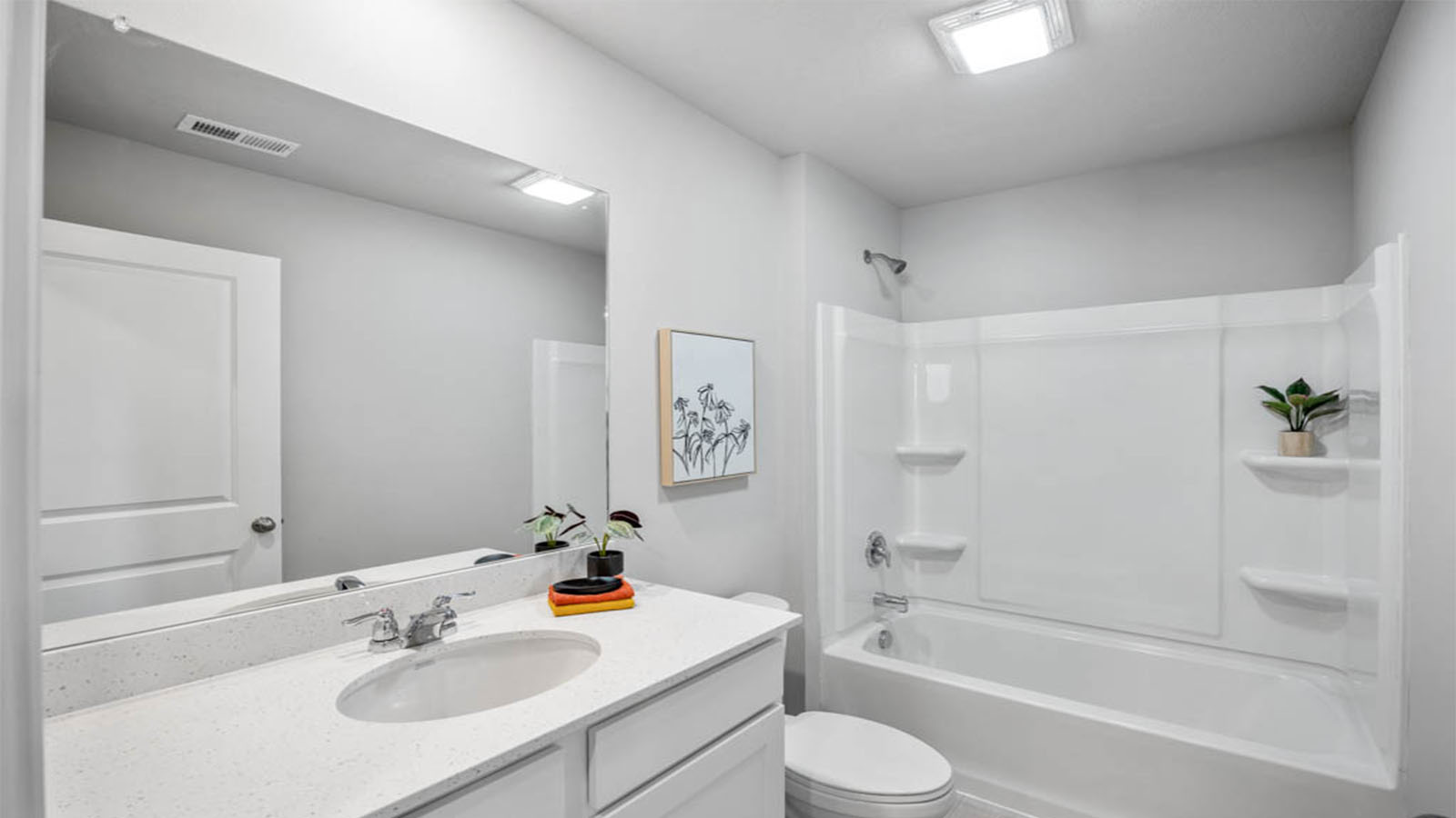 First bathroom with mirror and sink