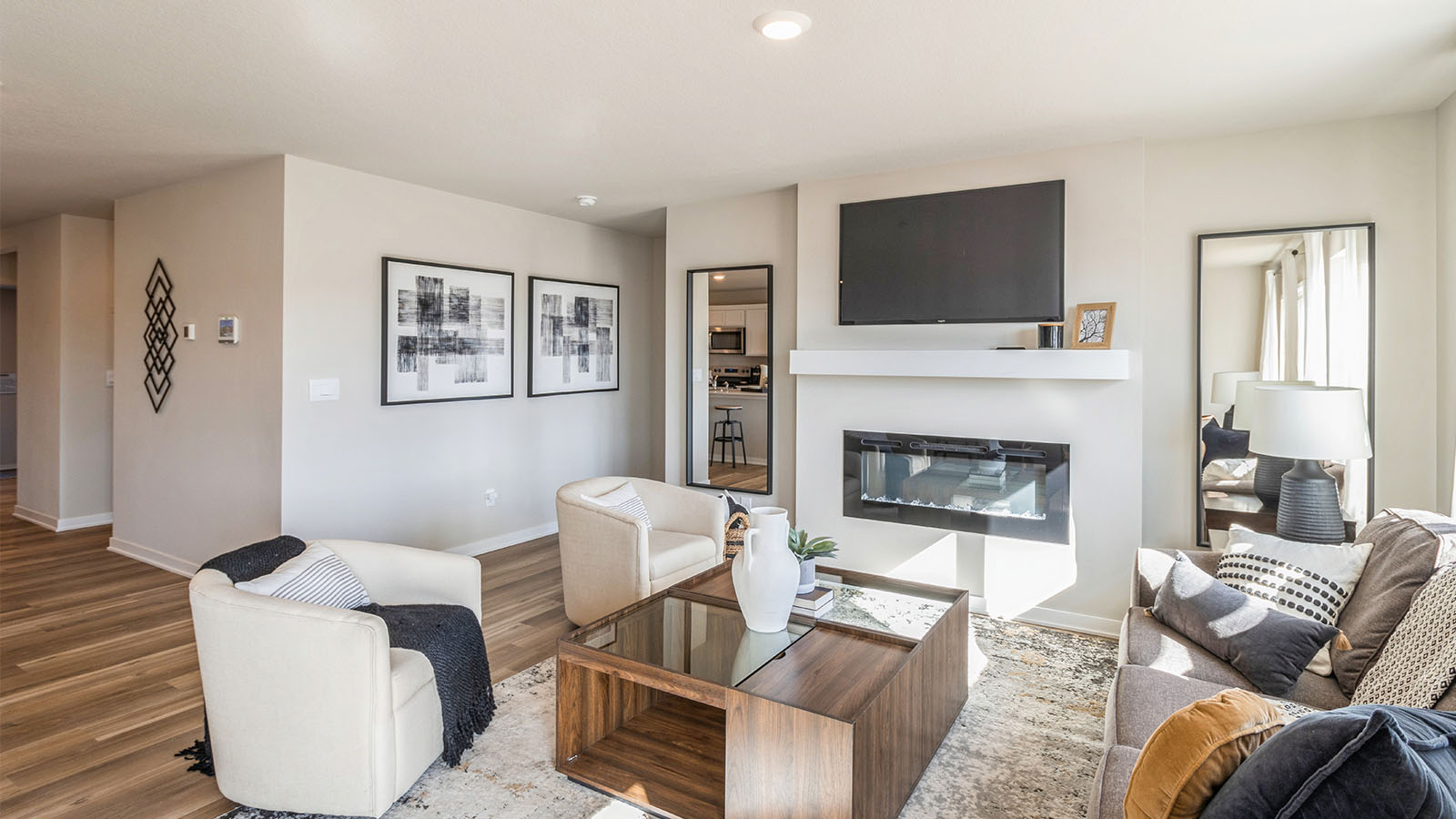 Roland living room with white seating and wood coffee table