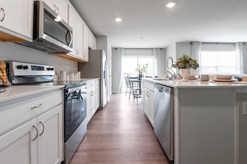 Kitchen with island and stainless-steel appliances