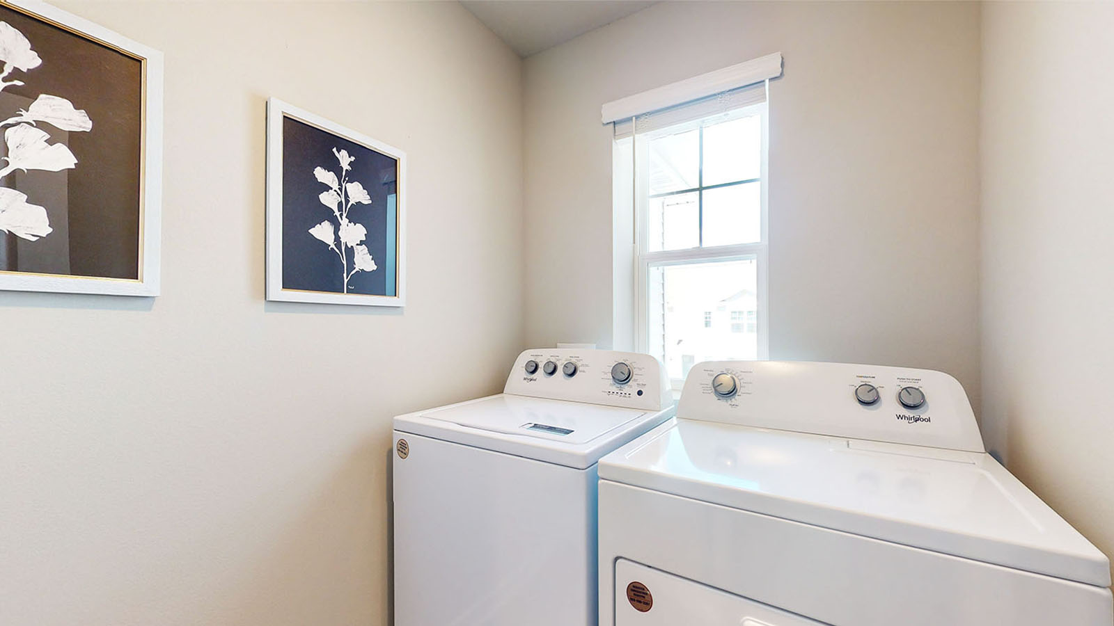 Upstairs laundry room with washer and dryer