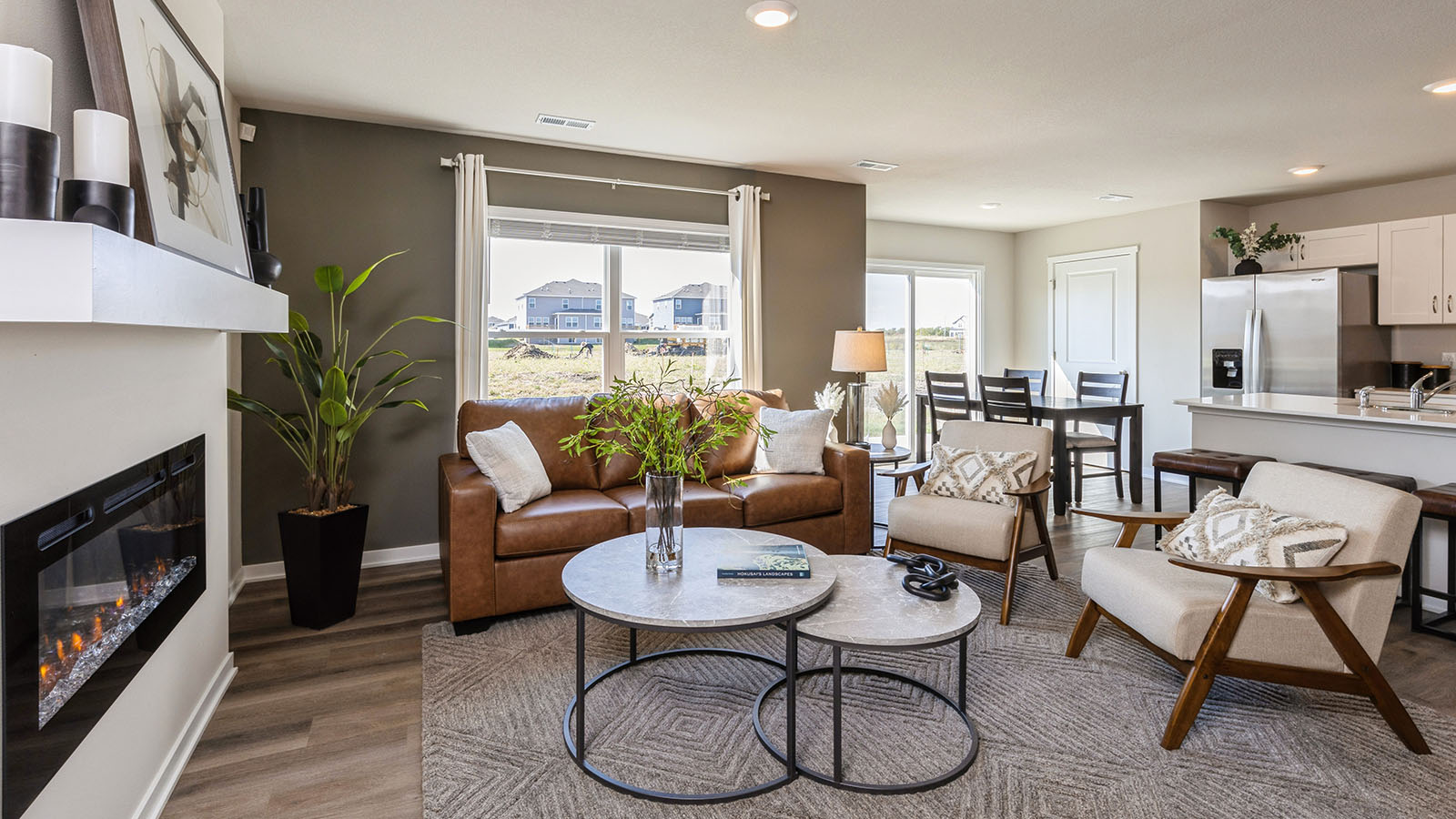 Spacious iving room with view of dining area and kitchen