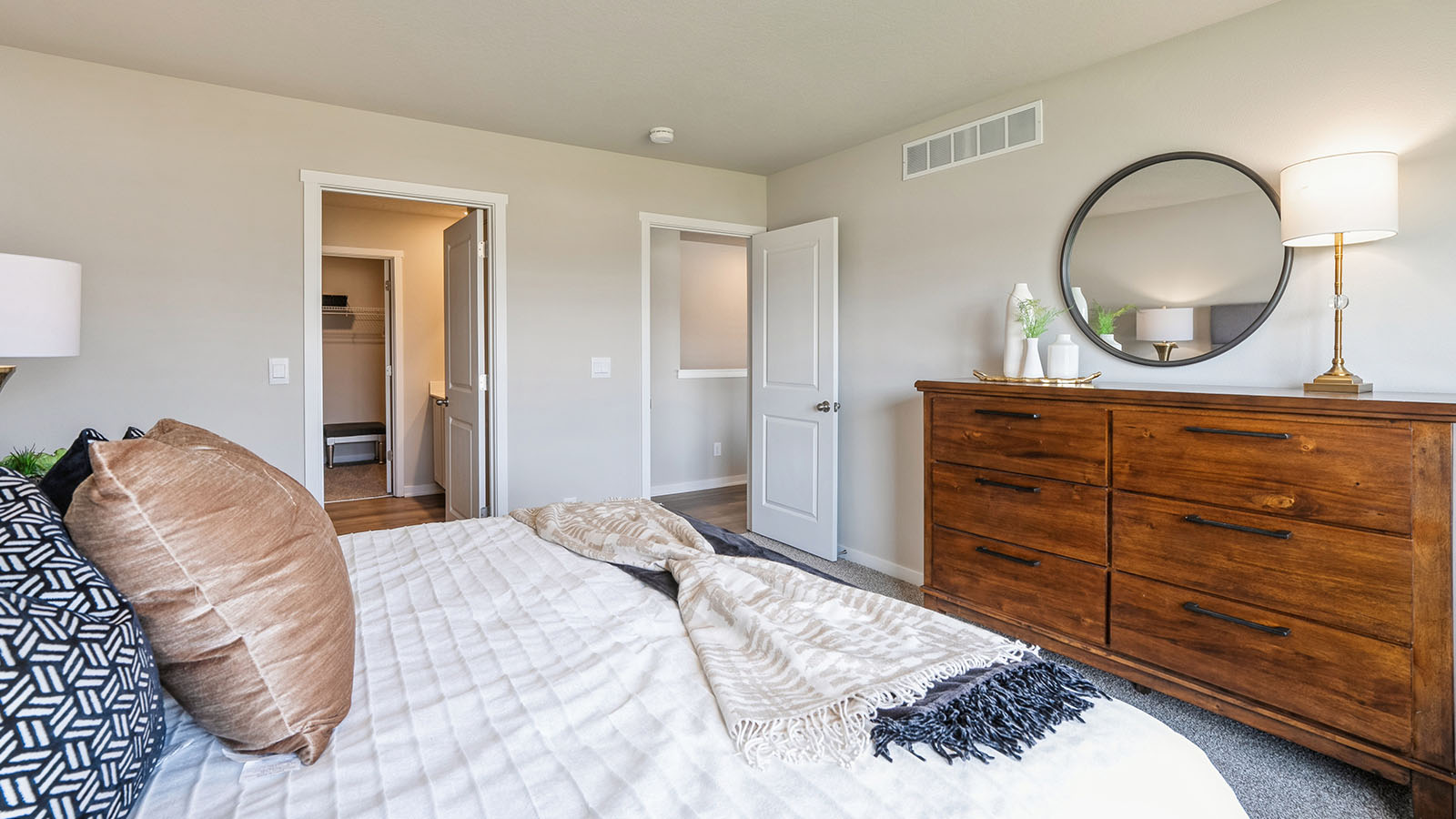 Primary bedroom with view of primary bathroom