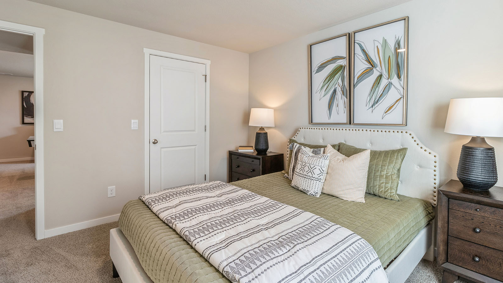 Secondary Bedroom in this Summercrest home showcases plush flooring, single door closet, and convenient hallway access.