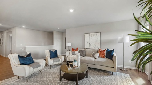 Living room with overhead lighting and seating