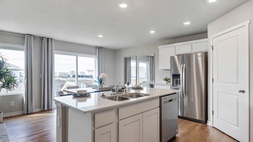 Kitchen island with stainless-steel appliances